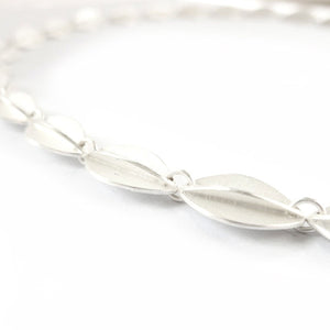 Contemporary sterling silver bracelet, leaf shape, handmade and bespoke by Sue Lane Jewellery. Perfect for Silver wedding anniversary, 21st birthday present