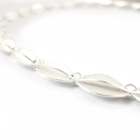 Contemporary sterling silver bracelet, leaf shape, handmade and bespoke by Sue Lane Jewellery. Perfect for Silver wedding anniversary, 21st birthday present