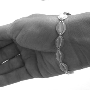 Contemporary sterling silver bracelet, leaf shape, handmade and bespoke by Sue Lane Jewellery. Perfect for Silver wedding anniversary, 21st birthday present